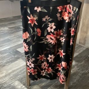 Woman’s straight back with floral skirt